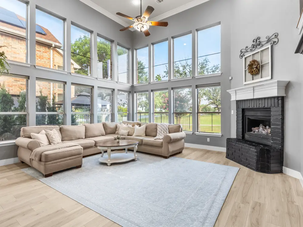 Two-story living room with wall of windows
