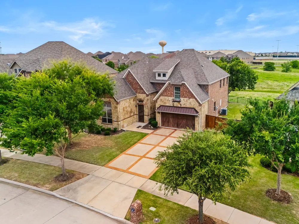 Aerial front elevation on a green lot