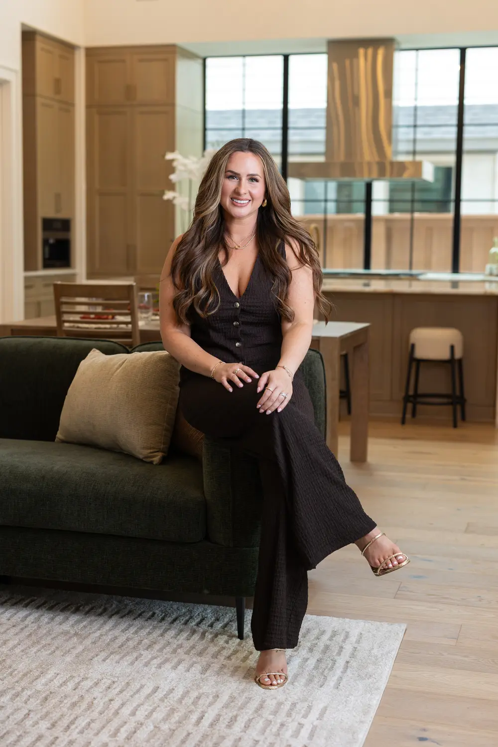 Seated lifestyle portrait in showroom kitchen