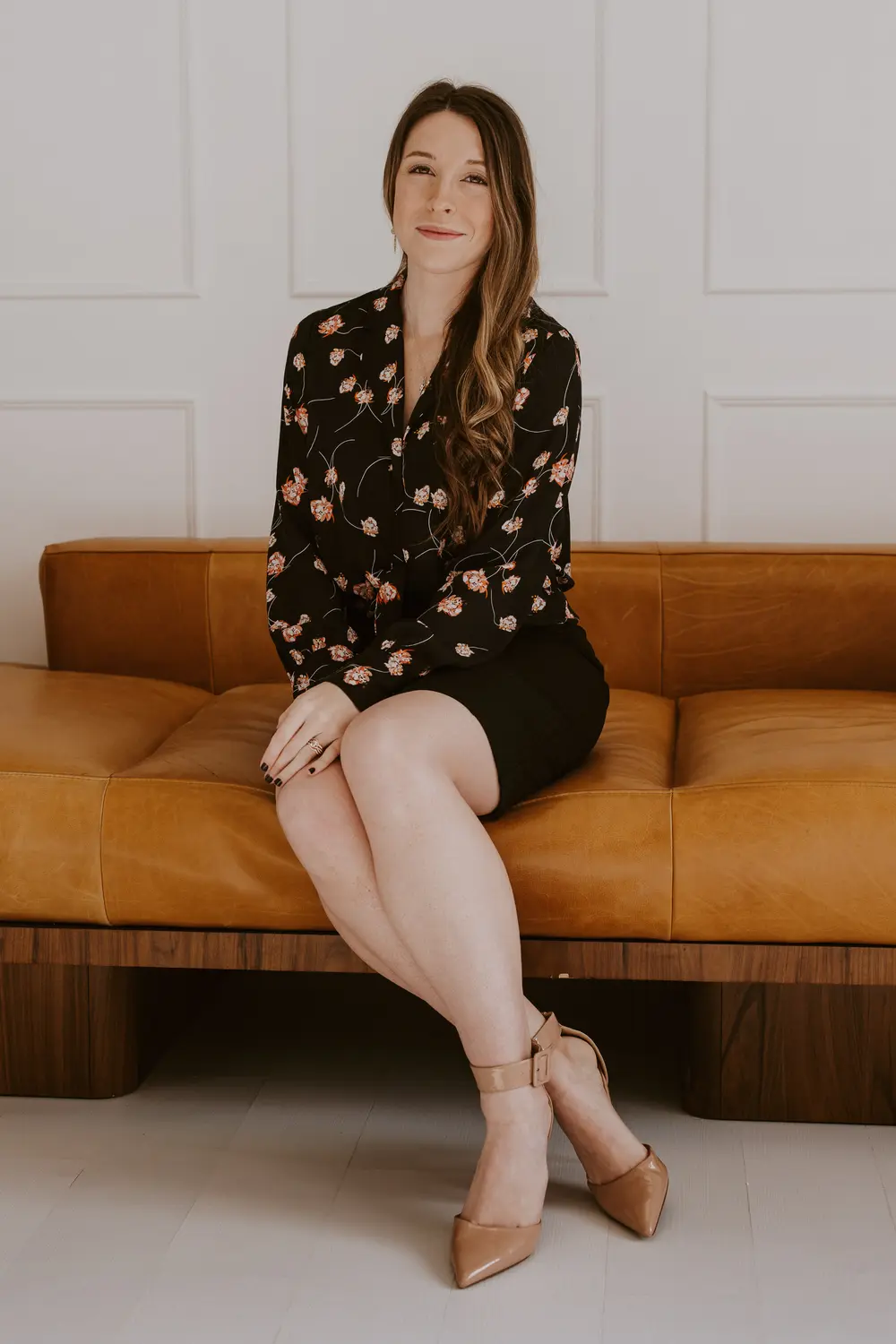 Agent portrait on leather sofa